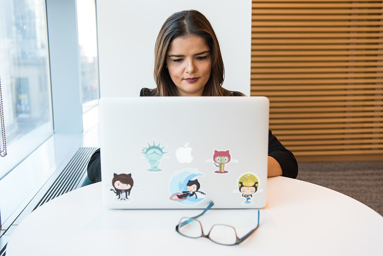 Executive working with a laptop in a modern office
