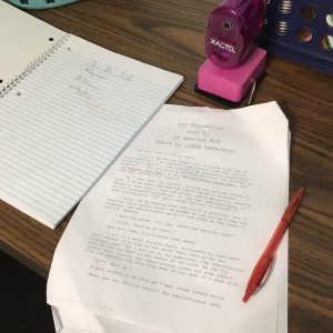 Handwritten notes and documents on a desk